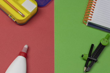 Back to school. Supplies on 2 color background