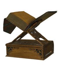 ancient parchment book on a carved wooden stand for reading, isolated on a white background