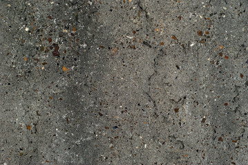 background, texture - gray rough concrete wall with colored stones of aggregate..