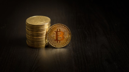  Bitcoin coins on black background