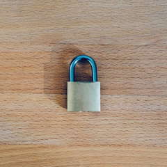 Fototapeta premium lock as symbol for Privacy and General Data Protection Regulation on wooden table