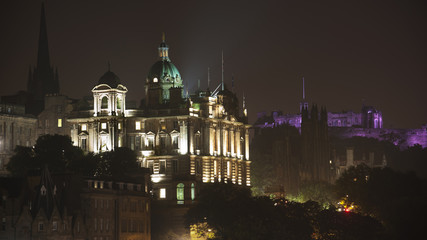 Fototapeta na wymiar Edinburgh cityscape at night with purple castle