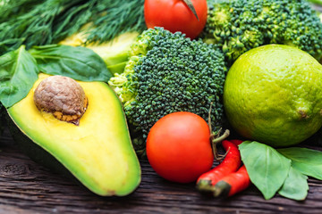 Fresh vegetables, lime and avocado close