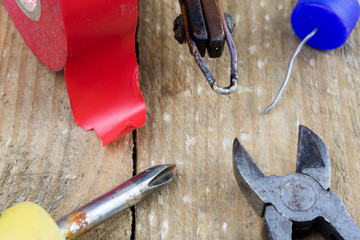 Accessories in the electronics workshop. Electronic meter, soldering iron and other tools needed...