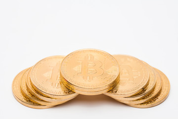 Stack concept of golden bitcoin on white background 