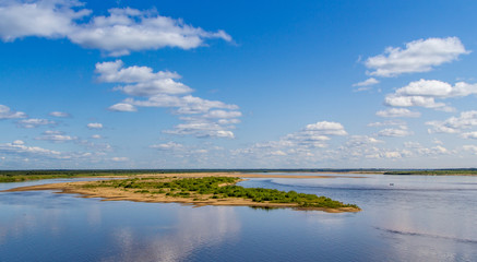 View of the river with clouds reflected in it