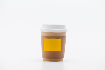 Yellow sticker at take out coffee cup isolated on a white