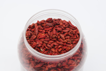  Dried red goji berries in plastic bottle isolated 
