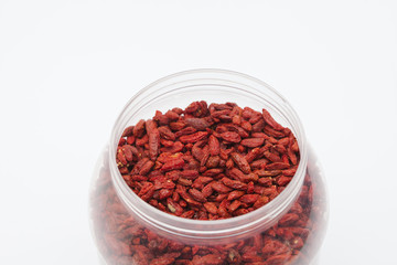  Dried red goji berries in plastic bottle isolated 