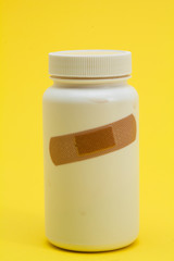 Band with Medicine bottle on the yellow background