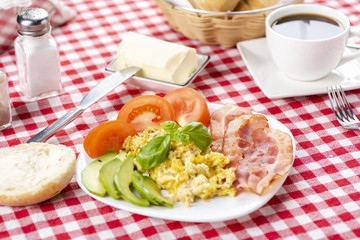 bacon and eggs with avocado and tomato, bread and coffee