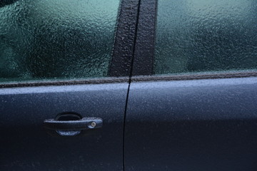 Frozen rain. Extreme weather. Danger for driving. Car locked.