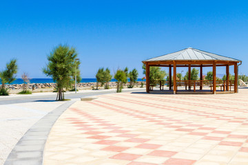 Wooden gazebo pergola playground recreation area at seaside public park