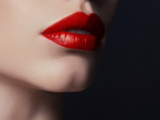 Sexual full lips. Red gloss of lips and woman's skin. The mouth is closed. Increase in lips,...