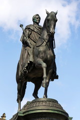 Fototapeta na wymiar King Johann horse rider statue, John of Saxony Monument in front of opera house Semperoper concert hall in Dresden, Germany