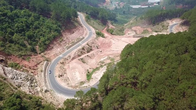 
Top view. Aerial view from drone. Royalty high quality free stock image of road in forest. Road in forest is beautiful with many tree, road on pass very winding and curve