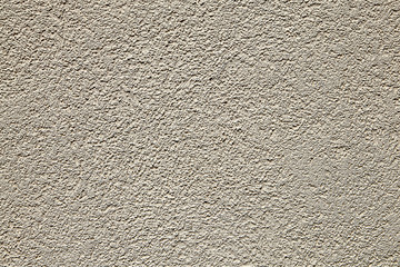 Naklejka premium Seamless stippled beige stucco wall texture background.