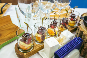 Candy bar with Sweet Pieces of strawberry, grapes, coconut shaving and chocolate designed as a canape.