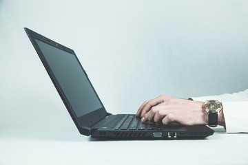 Businessman working on a laptop.