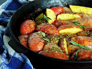potatoes rustic with rosemary and herbs before baking