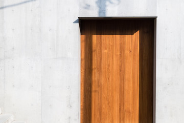 wooden door and concrete wall