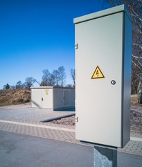 Two light gray transformer boxes