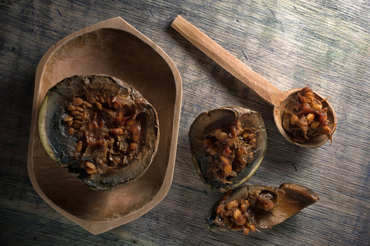 borojo fruit, considered a superfood,  in a wooden bowl on rustic background