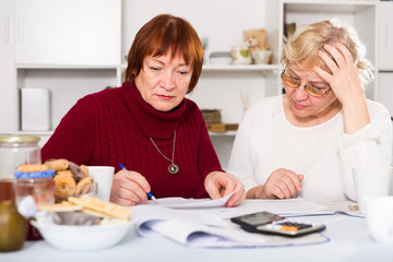Obraz na płótnie Canvas pensioners females with utilities bills