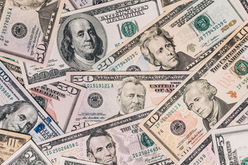 Pile of new and old one hundred dollar bills bills.