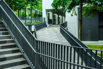 Empty stair and ramp construction in modern city. Cityscape in Singapore. Hightech and green. Pedestrian stairway in education center, school or university.