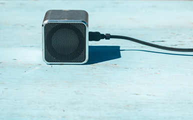  music loud speaker on blue background empty space for copy or text