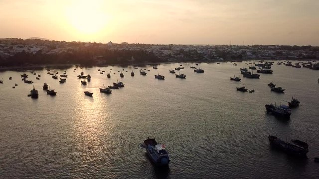 Top view. Aerial view sunset. Royalty high quality free stock footage of Mui Ne fishing harbour or fishing village. Mui Ne fishing harbor is a popular tourist destination. Phan Thiet city, Vietnam