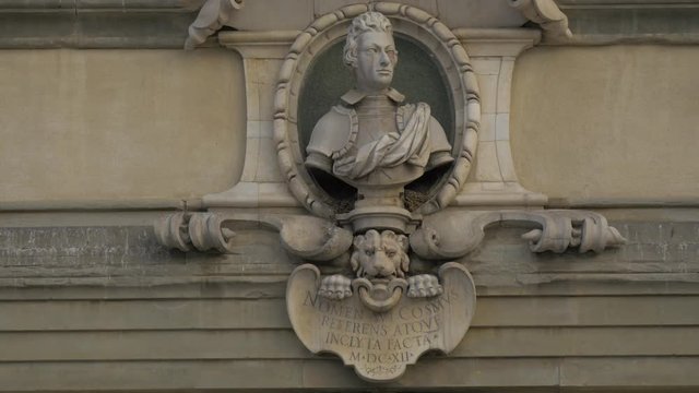 A bust on a building facade