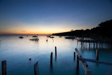 Fototapeta na wymiar before sunrise time and twilight sky at fisherman village in the sea