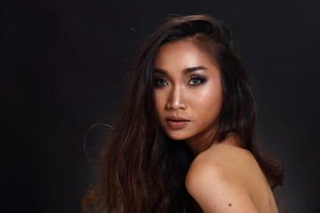 Naklejka premium Asian Long straight black hair tan skin woman in Black dress