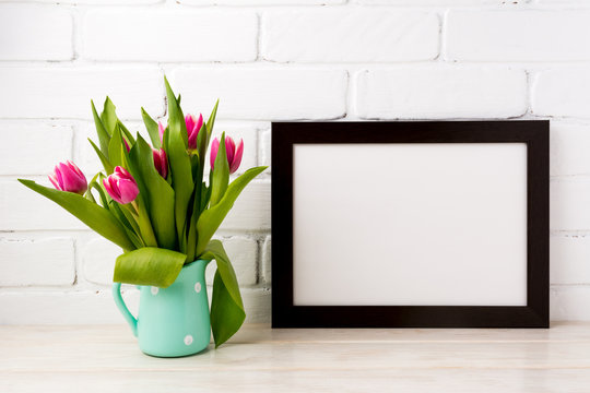 Black brown  landscape frame mockup with magenta tulips in mint green pitcher