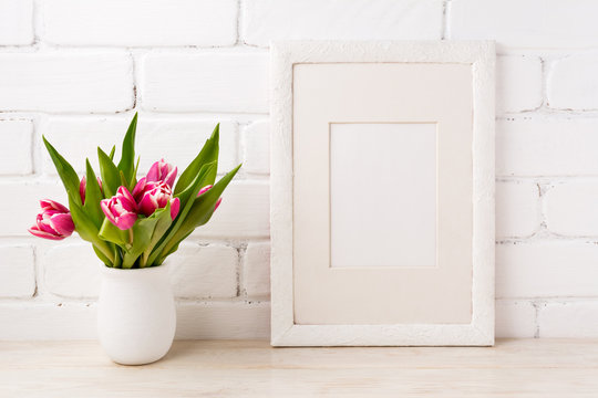 White frame mockup with magenta pink tulip in the flower pot