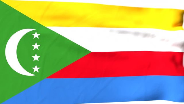 The waving flag of the Comoros opens up the view to the position of the Comoros on a colored world map