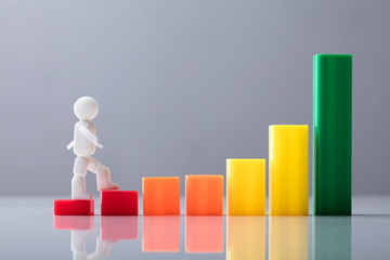 Human Figure Walking On Increasing Business Graph