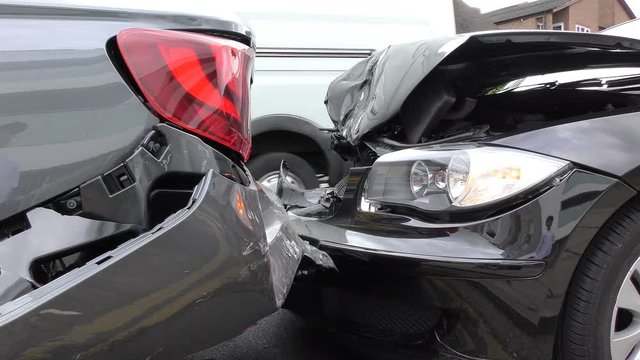 A car crashing into back of another.