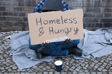 Male Beggar Lying On Street