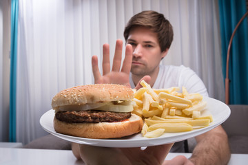 Man Refusing Unhealthy Food