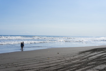Crowd of people enjoy the sea breeze of Krambitan beach in Bali,Indonesia