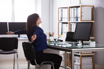 Businesswoman Stretching Her Arms