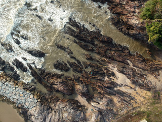 Aerial view of tropical rocky beach.