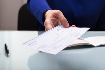 Businessperson Giving Cheque