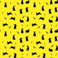 Seamless pattern, black silhouette bunnies on a yellow background, and a carrot,