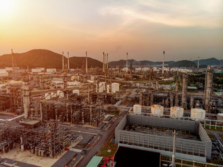 Aerial view of steel pipe oil refinery plant, power plant  at sunrise for industry concept.
