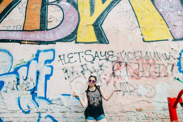 A young pretty girl spends his free time in the city. Photos on