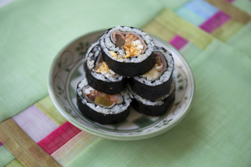 Kimbap filled with kimchi, vegetables, egg